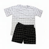 White grid print tee with black grid shorts laid flat