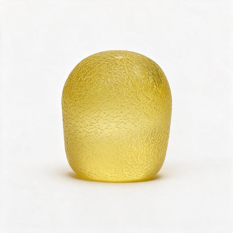 Yellow gumdrop squishy standing upright with a pebbled sugar texture