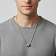 Man wearing a silver box chain with a crystal set cylinder pendant, Jack Gifts Online Lebanon