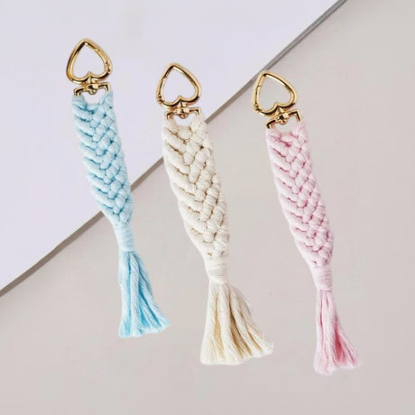 Handmade macrame keychains with gold heart clasps in blue, cream and pink