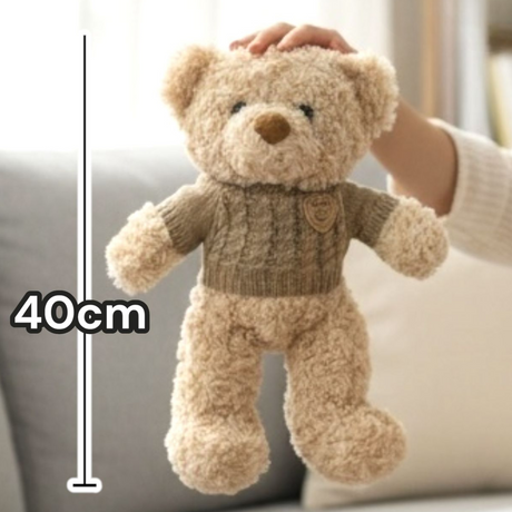 Oatmeal boucle bear in a cable knit jumper with a roll collar, marked 40cm