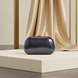 Navy blue hard case evening clutch with textured finish