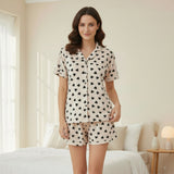 Woman standing in soft heart print cotton sleep set in bedroom - cozy loungewear for warm nights Lebanon