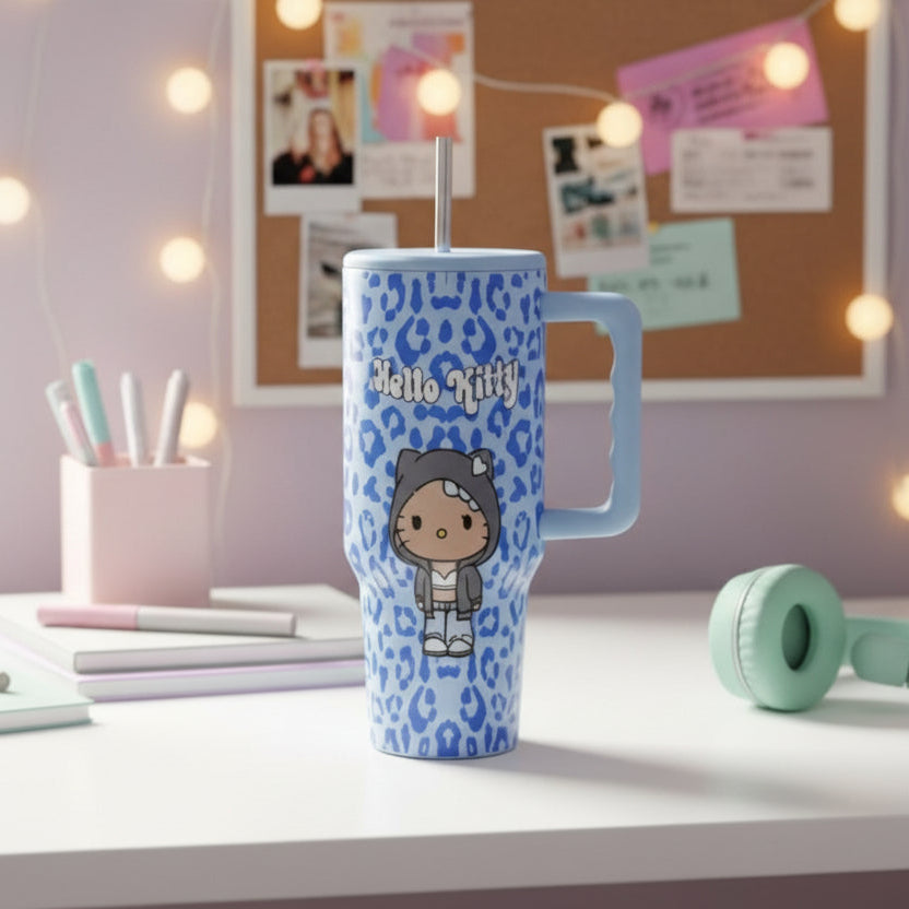 Light blue Hello Kitty tumbler with royal blue leopard print on a desk