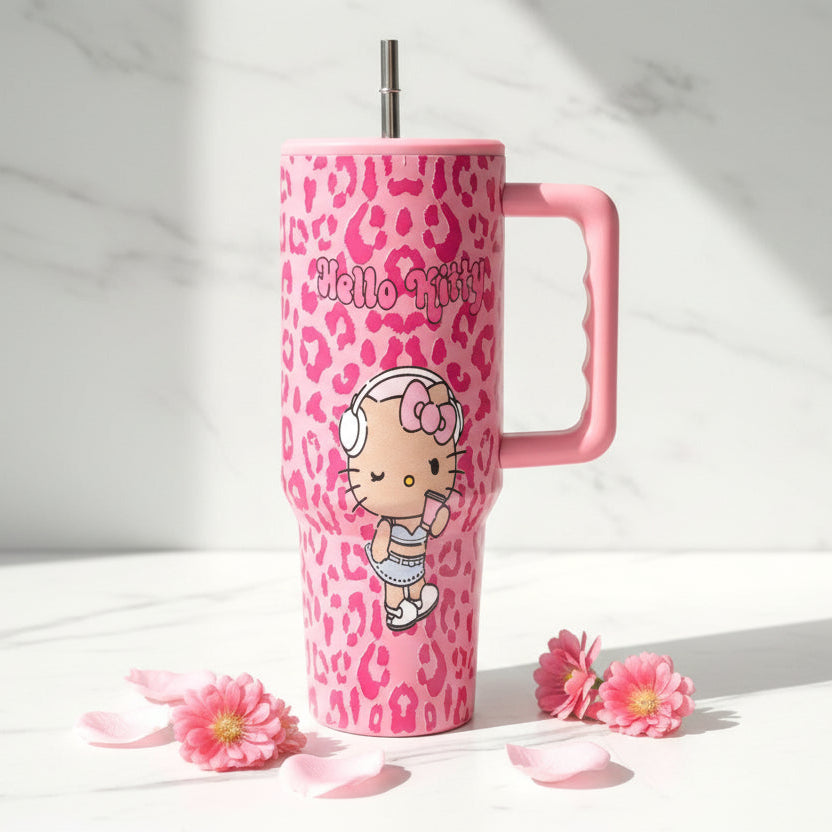Pink Hello Kitty tumbler on white marble with scattered pink blooms