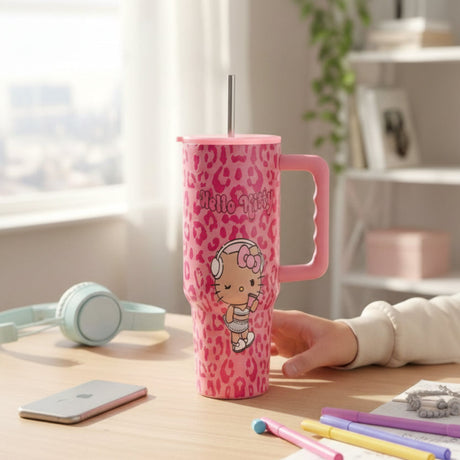Pink Hello Kitty tumbler with darker pink leopard print and a pink side handle