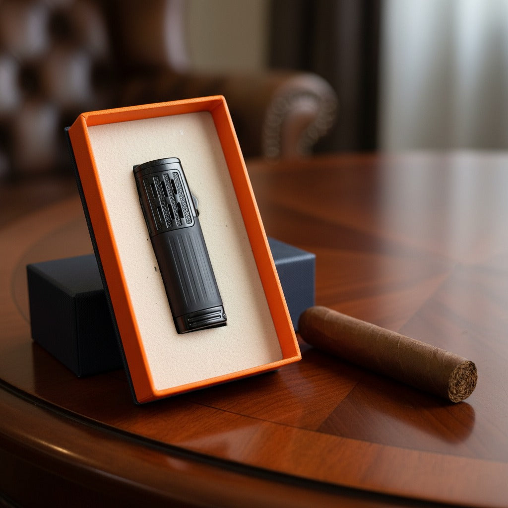 Black lighter in an orange box on a wooden table with a blurred background