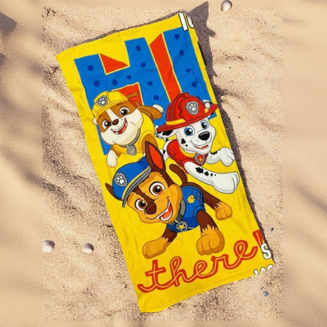 Yellow Paw Patrol beach towel printed with Chase, Marshall and Rubble and a Hi There slogan