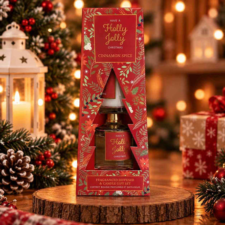 Holly Jolly cinnamon spice diffuser and candle set in a red Christmas tree window box