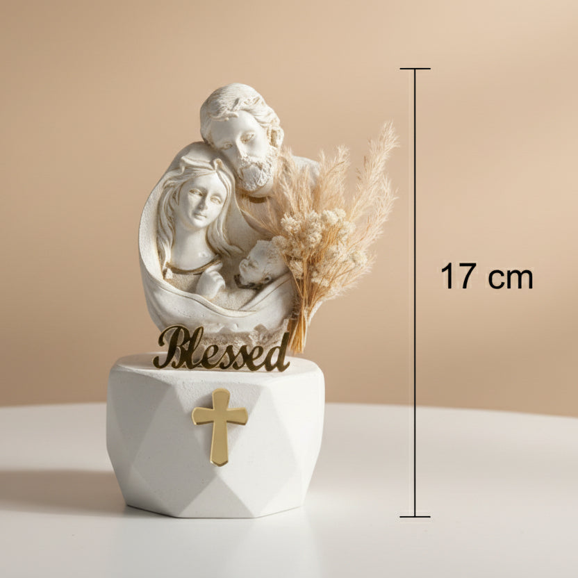 Joseph, Mary and the swaddled infant carved as one warm ivory group, marked 17 cm