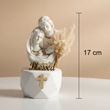 Joseph, Mary and the swaddled infant carved as one warm ivory group, marked 17 cm
