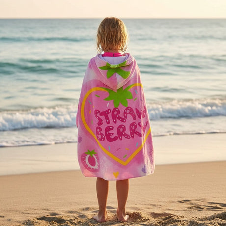 Back view of a strawberry hooded towel showing the heart graphic and green leaf hood topper