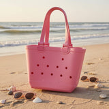 Kids hot pink EVA beach tote bag with a moulded flat base