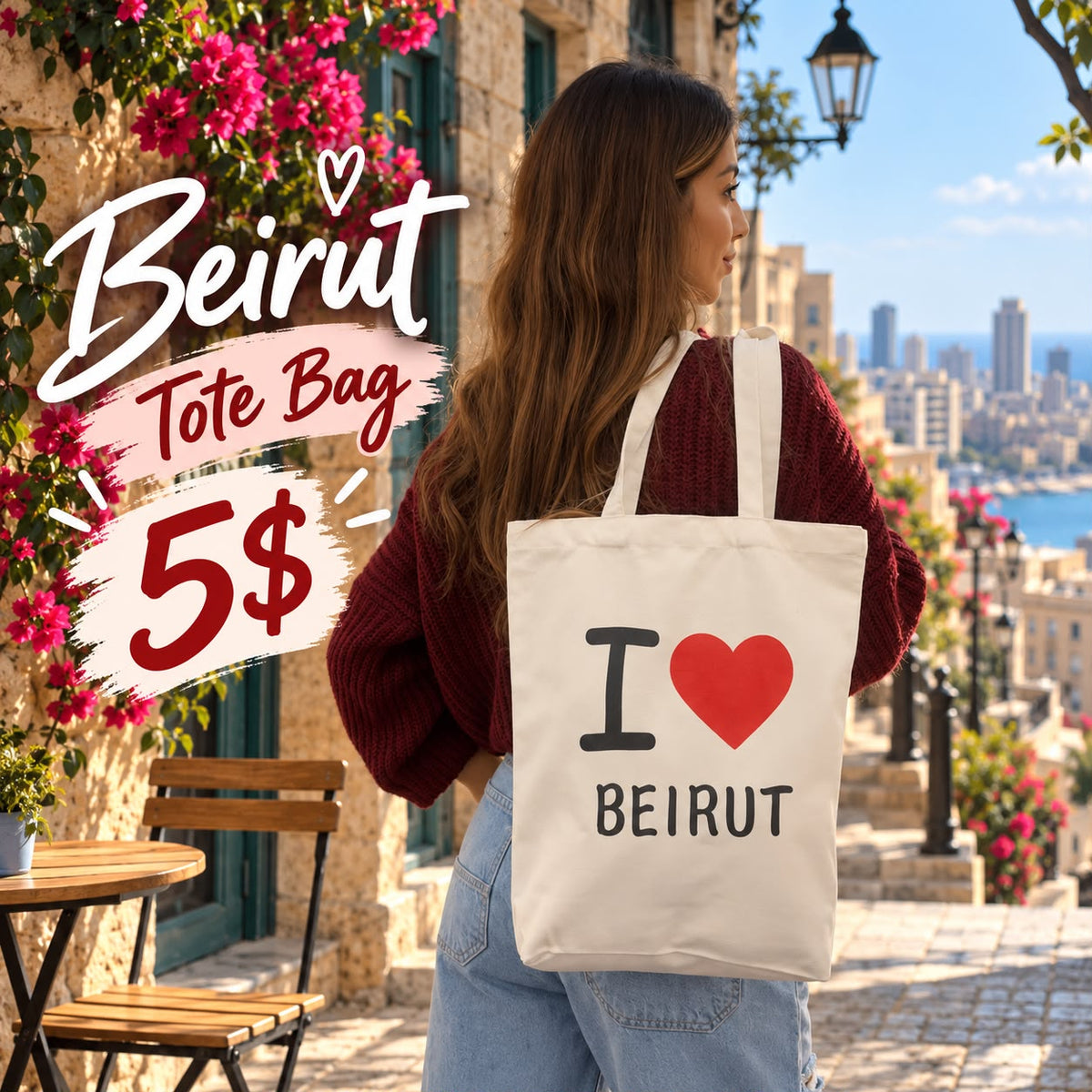 Back view of a cream I love Beirut canvas tote on the shoulder, city and sea in the distance