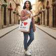 Woman carrying the I Love Beirut canvas tote through a stone alley