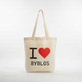 Natural canvas tote printed with a red heart above the word Byblos in black