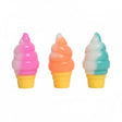 Three soft ice cream cone squishy toys with pink, orange and teal swirls on yellow cones