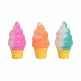 Three soft ice cream cone squishy toys with pink, orange and teal swirls on yellow cones