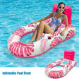 Woman on a pink inflatable pool float with palm leaf design in a pool