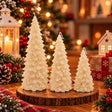 Three ivory Christmas tree shaped candles in small, medium and large sizes