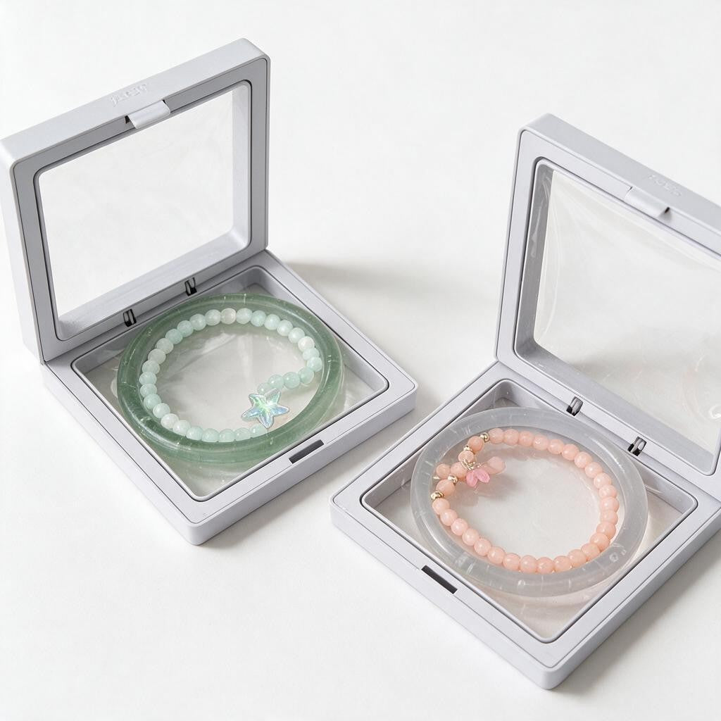 Mint green and pink jelly bangle and beaded bracelet sets in open white display boxes