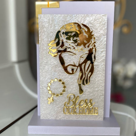 Gold profile of Christ crowned with thorns above the words Bless Our Home