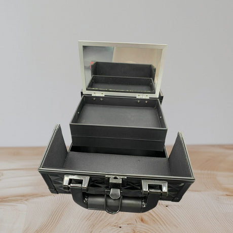 Vanity case open front on with a lid mirror, a full width tray and splayed side wings