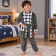 Boy in a khaki fleece robe with navy check trim, check top and grey trousers