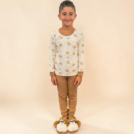 Kids bear face print pyjama top in cream worn with camel bottoms and slippers