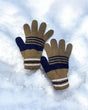Khaki knitted kids gloves with navy and cream stripes resting on snow