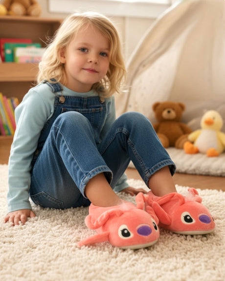 Young girl sitting on a rug wearing fluffy pink character slippers in a playroom
