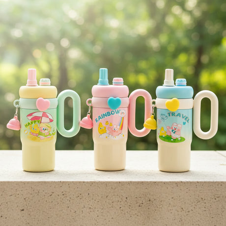 Four colorful children's sippy cups on a table with a store background.