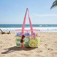 Kids yellow mesh beach bag with pink straps and clip-on pouch on the sand – Jack Gifts Online Lebanon