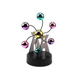 Kinetic desk gadget with a gold hub and six teal, pink and purple chrome balls on wire arms