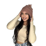 Dusty pink knitted beanie worn with a cream long sleeve top