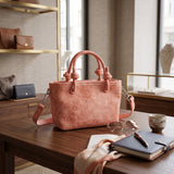 Coral knotted handle mini tote with a detachable crossbody strap
