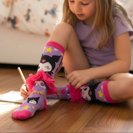 Girls purple knee high Kuromi socks with yellow stars, pink hearts and a pink tulle ankle frill