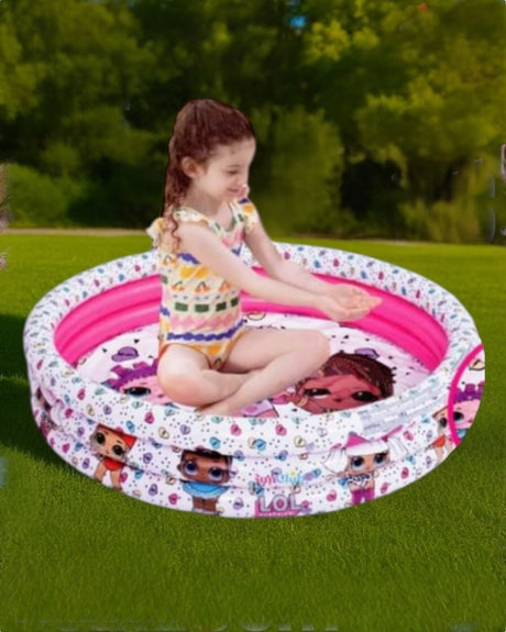 White three ring inflatable kids pool printed with big eyed cartoon dolls, girl sitting inside on a lawn