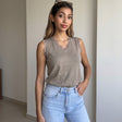 Beige sleeveless top with lace at the V neck