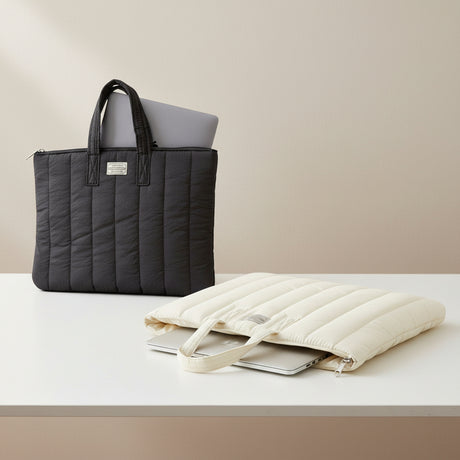 Black and beige quilted laptop sleeves shown together