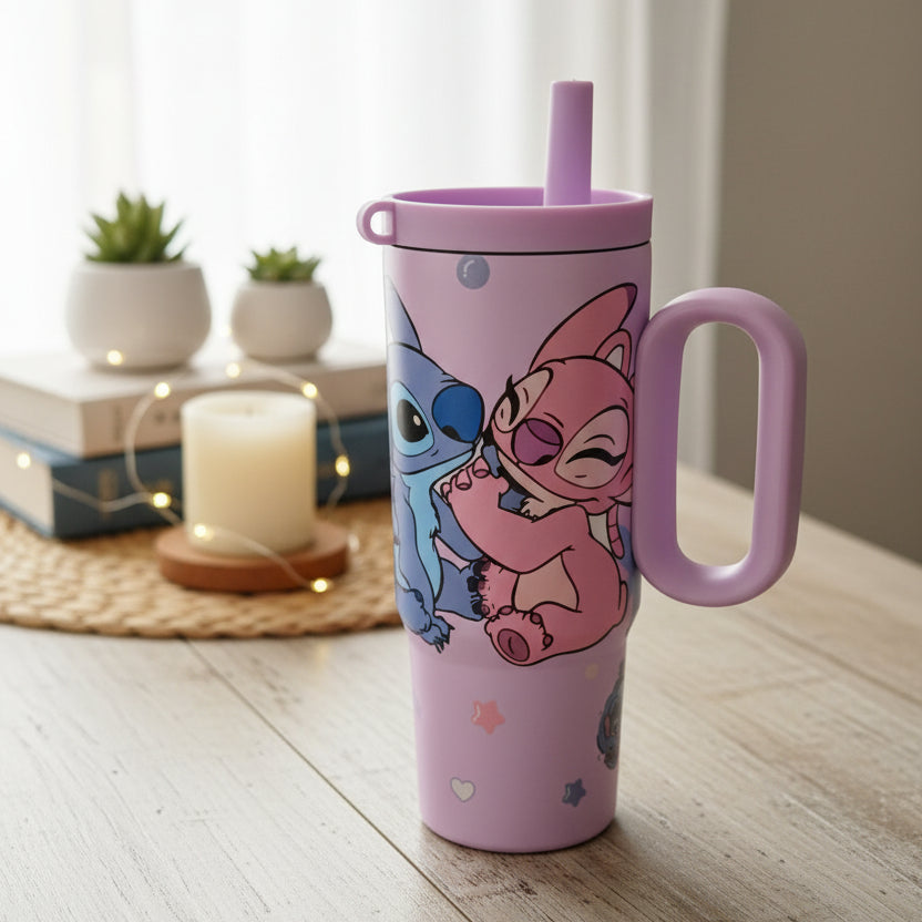 Lilac Stitch and Angel tumbler styled with books, a candle and fairy lights