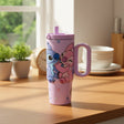 Lavender Stitch tumbler printed with Stitch and Angel hugging, on a wooden counter