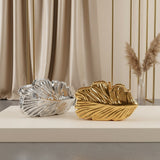 Leaf shaped evening clutches in silver and gold – Jack Gifts Online Lebanon