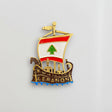 Phoenician ship magnet in antique bronze with a flag sail and blue enamel waves