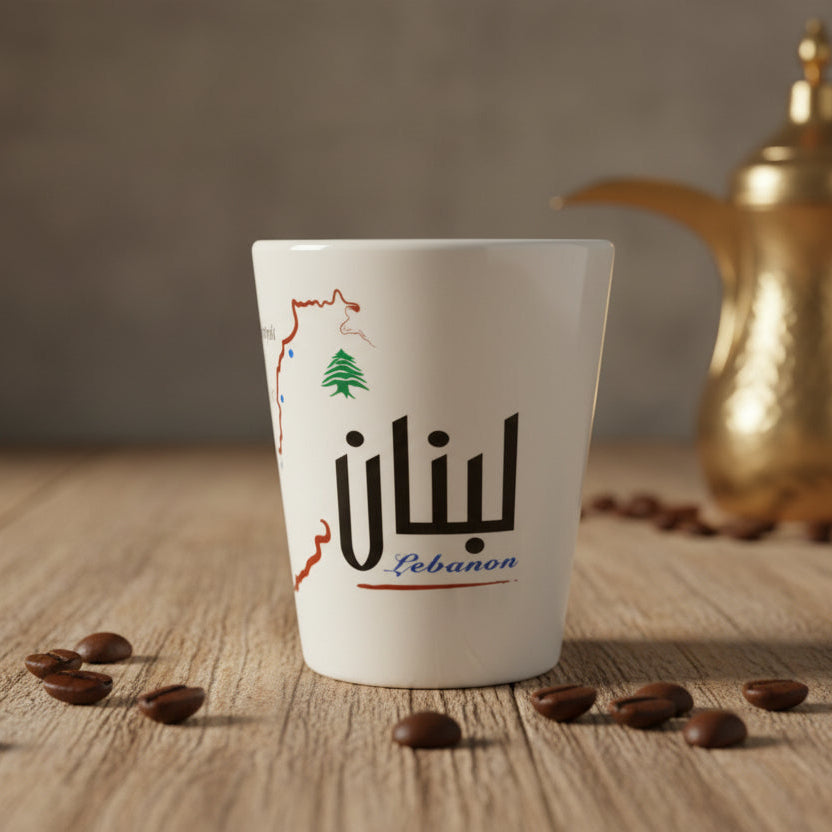 White porcelain tumbler printed with a red city map, a green cedar and Lebanon in Arabic