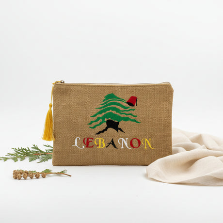 Woven jute zip pouch with a cedar tree in a red tarbouche above Lebanon in bright letters
