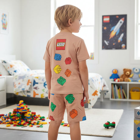 Back view of a beige boys tee with a colourful brick print and matching printed shorts