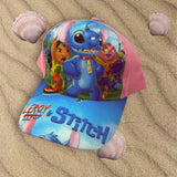 Pink and blue childrens baseball cap with cartoon alien artwork and bold peak lettering
