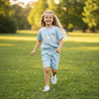 Girl running in light blue Enjooy print tee and shorts set, Jack Gifts Online Lebanon