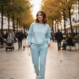 Women's light blue crew neck sweatshirt with matching tapered joggers